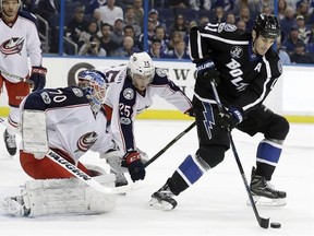 Tampa Bay Lightning centre Brian Boyle (11) takes a pass in front of Columbus Blue Jackets goaltender Joonas Korpisalo (70) and William Karlsson (25) during the second period of an NHL hockey game Friday, Jan. 13, 2017, in Tampa, Fla. The Toronto Maple Leafs have plugged a year-long hole at the fourth-line centre spot, swinging a trade with the Lightning for Boyle on Monday afternoon. THE CANADIAN PRESS/ AP/Chris O&#039;Meara