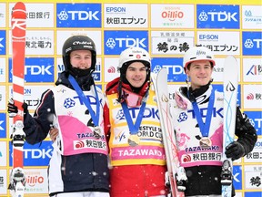 (Left to right) Benjamin Cavet of France (silver), Mikaël Kingsbury of Canada (gold) and Matt Graha of Australia pose with their medals for the men's dual moguls during 2017 FIS Freestyle Ski World Cup at Tazawako Ski Resort on February 19, 2017 in Senboku, Japan.