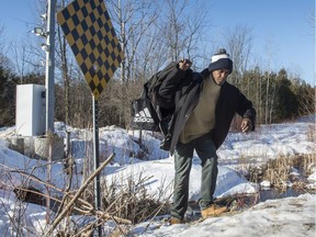 A refugee claimant from Mauritania crosses the border into Canada from the United States Monday, February 20, 2017 near Hemmingford, Que. A growing number of people have been walking across the border into Canada to claim refugee status.