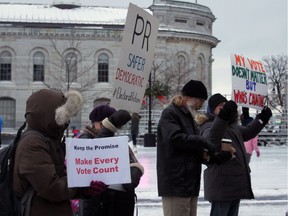 About 50 demonstrators gathered to protest the Trudeau government reneging on their promise of electoral reform in Springer Market Square in  Kingston, Ont. on Saturday February 11, 2017. Steph Crosier/Kingston Whig-Standard/Postmedia Network