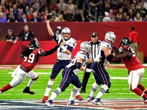 Tom Brady of the New England Patriots looks to avoid the tackle of De'Vondre Campbell of the Atlanta Falcons during the second quarter during Super Bowl 51 at NRG Stadium on Feb. 5, 2017 in Houston, Tex.