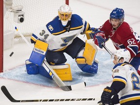 Canadiens' Artturi Lehkonen moves in on St. Louis Blues goalie Jake Allen as defenceman Kevin Shattenkirk defends during first period NHL hockey action in Montreal on Saturday, Feb. 11, 2017.