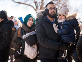 People gather for the funeral of three of the six victims of the massacre at the Grand Mosque of Quebec at arrival at the Maurice Richard arena, in Montreal, on February 2, 2017.