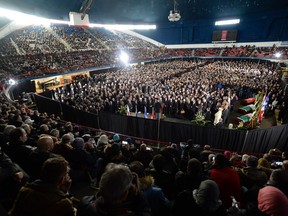 An overall view of the funeral for Abdelkrim Hassane, Khaled Belkacemi and Aboubaker Thabti, three of the six victims of the Quebec City mosque shooting,  at the Maurice Richard Arena in Montreal, on February 2, 2017. Canadian Prime Minister Justin Trudeau on Thursday attended the funeral of two Algerians and a Tunisian man killed with three others in a mosque shooting, as he seeks to pull together a nation shaken by the hate crime. Up to 5,000 mourners were expected to pack a hockey arena in Montreal's Olympic park for the funeral, while millions across Canada watch it on television.