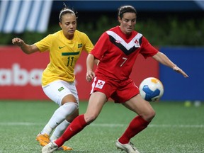 Canada's Rhian Wilkinson, right, fights for the ball with Brazil's Thais Guedes during a women's soccer match at the Pan American Games in Guadalajara, Mexico, Saturday, Oct. 22, 2011. Away from the soccer pitch, Wilkinson has walked part of the Camino de Santiago, run a marathon and crewed a yacht in the Mediterranean in recent years.