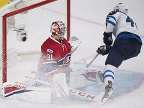 Canadiens goaltender Carey Price is scored on by Winnipeg Jets' Joel Armia during second period NHL hockey action in Montreal on Feb. 18, 2017.