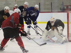 Devon Levi, in goal, scrimmages with NHL players including the Tampa Bay Lightning's Alex Killorn, the Florida Panther's Michael Matheson and Emile Poirier of the Calgary Flames, Summer, 2016.