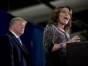 Former Alaska Gov. Sarah Palin, right, endorses  Republican presidential candidate Donald Trump during a rally at the Iowa State University, Tuesday, Jan. 19, 2016, in Ames, Iowa.