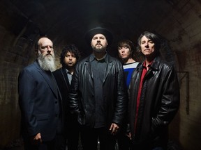 "I didn’t expect it to be as timely this year as it was back in the fall,” singer/guitarist Patterson Hood, centre, says of Drive-By Truckers' American Band, which tackles subjects including the Confederate flag and immigration. “I really would rather it have been a time capsule of that troubled time we were in last year.” Hood is joined in the southern-rock band by drummer Brad Morgan, left, multi-instrumentalist Jay Gonzalez, bassist Matt Patton and singer/guitarist Mike Cooley.