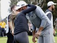 Dustin Johnson kisses his wife, Paulina Gretzky, on the 18th green after winning the Genesis Open golf tournament at Riviera Country Club on Sunday, Feb. 19, 2017, in the Pacific Palisades area of Los Angeles.