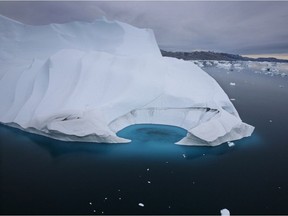 In this July 19, 2007 file photo, an iceberg melts off the coast of Ammasalik, Greenland.