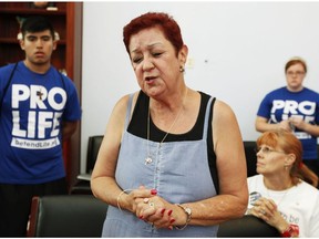 In this July 28, 2009, file photo, Norma McCorvey, right, the plaintiff in the landmark lawsuit Roe v. Wade, speaks up as she joins other anti-abortion demonstrators inside House Speaker Nancy Pelosi's office on Capitol Hill in Washington.  McCorvey died at an assisted living centre in Katy, Tex., on Saturday, Feb. 18, 2017, said journalist Joshua Prager, who is working on a book about McCorvey and was with her and her family when she died. He said she died of heart failure.