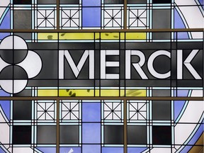 This December 2014 file photo shows the Merck logo on a stained glass panel at a Merck company building in Kenilworth, N.J.