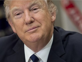 This file photo taken on February 14, 2017 shows  US President Donald Trump speaking during a meeting at the White House in Washington, DC. Trump said on February 25, 2017, he will not attend the White House Correspondents' Dinner, breaking with an annual tradition in which the US president attends a light-hearted roast held by journalists and attended by celebrities.