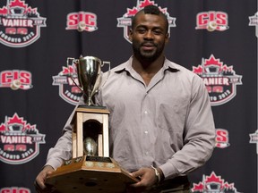 Linebacker Frédéric Plesius, seen here posing with the Canadian Interuniversity Sport  President's trophy on November 22, 2012, has been traded to the Montreal Alouettes.