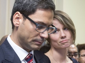 Montreal MNA Gerry Sklavounos speaks to the media as his wife Janneke Van Berge Henegouwen looks on during a news conference, in Montreal on Thursday, February 9, 2017.