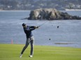Jordan Spieth follows through on his approach shot from the fairway to the 18th green of the Pebble Beach Golf Links during the final round of the AT&T Pebble Beach National Pro-Am golf tournament Sunday, Feb. 12, 2017, in Pebble Beach, Calif. Spieth won the tournament by four strokes and finished at total 19-under-par.