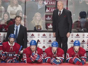 Canadiens head coach Michel Therrien looks on from the behind the bench during the closing moments of an NHL hockey game against the St. Louis Blues in Montreal on Saturday, Feb. 11, 2017.