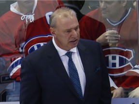 Montreal Canadiens coach Michel Therrien watches during the first period of the team's NHL hockey game against the Montreal Canadiens on Tuesday, Feb. 7, 2017, in Denver.