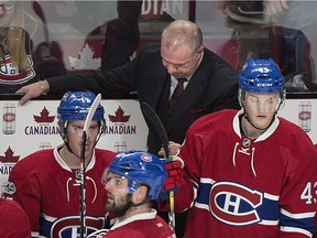 Montreal Canadiens head coach Michel Therrien looks down from behind the bench during the closing moments of an NHL hockey game against the St. Louis Blues in Montreal, Saturday, Feb. 11, 2017. Claude Julien has replaced Therrien as coach of the Canadiens.