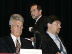 Jean Robaillard (rear), the administrator and bankruptcy trustee acting for the Mount Real companies at a creditors meeting for bankrupt companies in the Mount Real group in Montreal in 2006 as Mount Real principals Lowell Holden (seated, left) and Lino Matteo listen to the briefing.