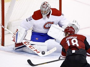 Montreal Canadiens goalie Carey Price (31) makes a save on a shot by Arizona Coyotes centre Christian Dvorak (18) during overtime of an NHL hockey game Thursday, Feb. 9, 2017, in Glendale, Ariz. The Canadiens defeated the Coyotes 5-4.