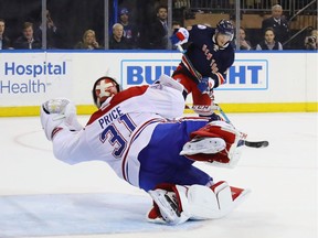 Carey Price Canadiens makes a diving save in the closing seconds of overtime against the Rangers' J.T. Miller Tuesday night in New York.