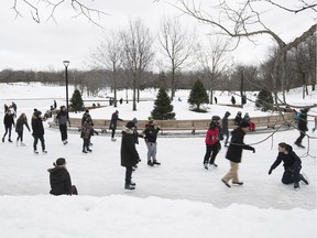 People skate around the refrigerated ice rink at Beaver lake on Tuesday December 27, 2016.