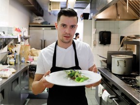 Charles-Antoine Malenfant-Beaulieu delivers a Halibut main course at Prince Restaurant.
