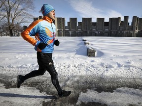 Elite triathlete Mohamad Alsabbagh runs along Rene Levesque Blvd. in Montreal Friday February 10, 2017.  He is from Syria and is worried that Donald Trump's travel ban could prevent him from competing in two major races in the USA and hurt his chances of qualifying for the 2020 Olympics.