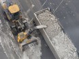 Snow removal crews clear Guy St. after a major snowfall in Montreal Feb. 14, 2017.