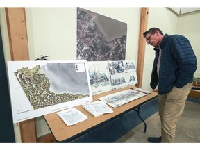 Fred van Noord looks at plans for the proposed Sandy Beach residential project during an information meeting held by Nicanco Holdings in Hudson held in February 2017. The housing project has since been put on hold.