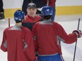 Head coach Claude Julien left speaks with Phillip Danault and Max Pacioretty during the teams annual open practice at the Bell centre in Montreal on Sunday, Feb. 19, 2017.