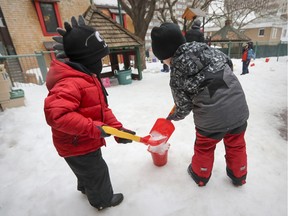 Children play in the snow at a CPE daycare in downtown Montreal Tuesday Feb. 21, 2017.