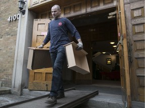 MONTREAL, QUE.: FEBRUARY 23, 2017 -- Movers Andrew Norton carries furniture and household goods as he moves articles to a storage facility in Nun's Island  from the Temple Emanu-el-Beth Sholom on Thursday February 23, 2017. The furnishings are part of the  $70,000 raised by the synagogue to help sponsor 2 Syrian families. The first family will arrive in Montreal from Jordan on Monday. (Pierre Obendrauf / MONTREAL GAZETTE) ORG XMIT: 58175 - 9169