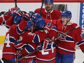 Canadiens' Alex Galchenyuk (27) is mobbed by his teammates after scoring the game-winning goal during overtime Tuesday night at the Bell Centre.