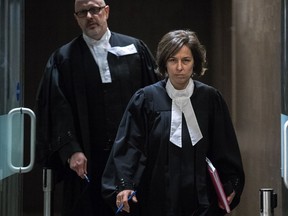 Crown prosecutors Marlene Archer and Pascal Lescarbeau leave the courtroom at the Palais de Justice in Montreal Feb. 3, 2017, after Archer revealed she had "involuntarily mislead" the court in disclosure of wiretaps.