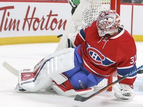 Canadiens Carey Price slides past the goal post to make a save against the Washington Capitals in Montreal on Saturday, Feb. 4, 2017.