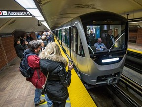 Passengers ready to board the Métro.