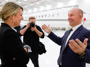 Federal minister Mélanie Joly smiles as she speaks with Bombardier CEO Alain Bellemare after a press conference at Bombardier in Montreal on Tuesday February 7, 2017.
