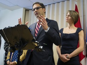 Laurier-Dorion MNA Gerry Sklavounos, left, with his wife Janneke, right, as he addresses the media in Montreal, Thursday February 9, 2017, making a declaration as part of his bid to return to the provincial Liberal caucus after being cleared of sexual assault allegations.