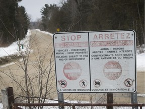 The Canada-U.S. border looks onto Roxham Road in Champlain, N.Y., from Roxham Rd. in Saint-Bernard-de-Lacolle, near Hemmingford, Quebec on Thursday February 9, 2017.