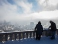 The Montreal city skyline from the Mount-Royal summit on a cold and smoggy winter day in 2015.