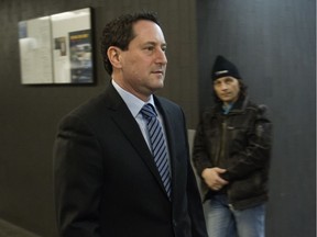 Former Montreal mayor Michael Applebaum, left, returns to a courtroom after a break at the Montreal courthouse, Feb. 15, 2017, for the continuation of his sentencing hearing at his fraud trial.