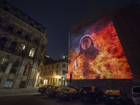 An image depicting Marie-Josèphe Angélique is shown in a Cité Mémoire video projection in Montreal. Angélique was a slave who was sentenced to hang after she was accused of setting a fire that spread across what is now Old Montreal.