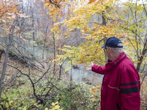 Resident Richard Meades walks through a location in the Chaline Valley area with risk of mudslides near the corner of Charbonneau and Carillion streets in St-Lazare on Oct. 30, 2016.