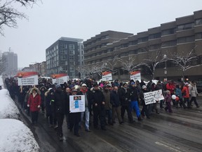 Hundreds march to the National Assembly building in Quebec City on Sunday, Feb. 5, 2017.