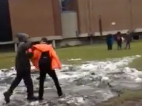 A screen grab from a Facebook video shows a child being bullied at a Vaudreuil high school.