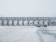 Cars line up at Canadian-United States border at the St-Bernard-de-Lacolle, Que.