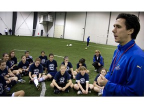 Impact coach Mauro Biello coaching a Pierrefonds girls' team on the St-Lazare turf in 2009.